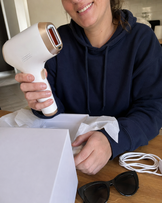 Customer unboxing the Novora IPL device at home